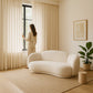 Curved Sofa Upholstered In White Bouclé – Modern And Elegant Design - Sorela