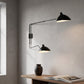 Lámpara de pared de dos brazos en hierro negro con pantallas de latón, aplique moderno y minimalista para salones y dormitorios
